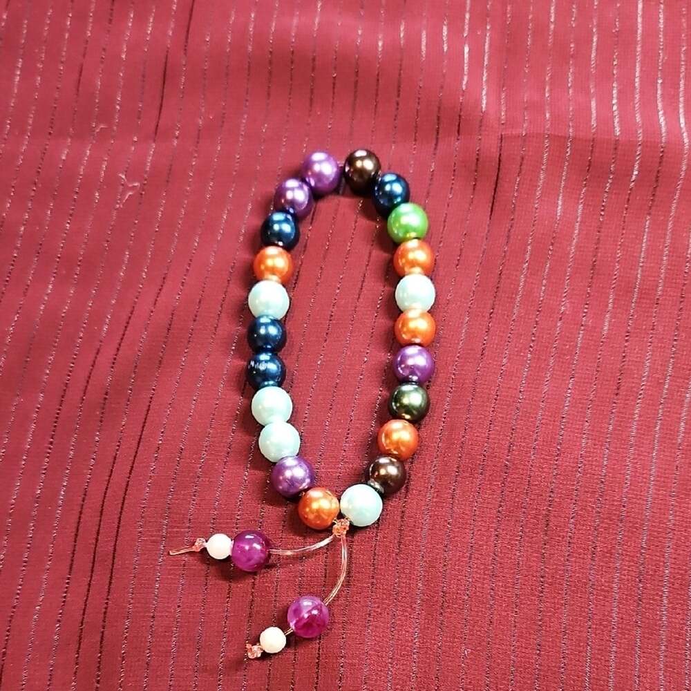 Vibrant Purple and Blue Beaded Bracelet with Ornamental Tassel